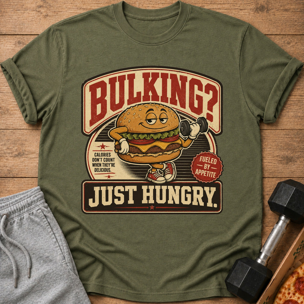 T-shirt with cartoon burger lifting weights, text "Bulking? Just Hungry."