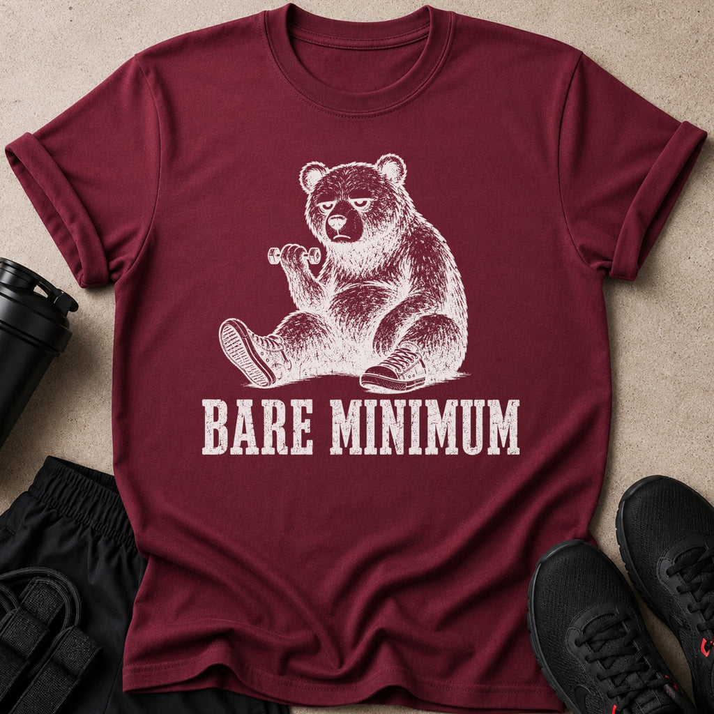 Maroon t-shirt with a drawing of a tired bear lifting a dumbbell, text reads "BARE MINIMUM".