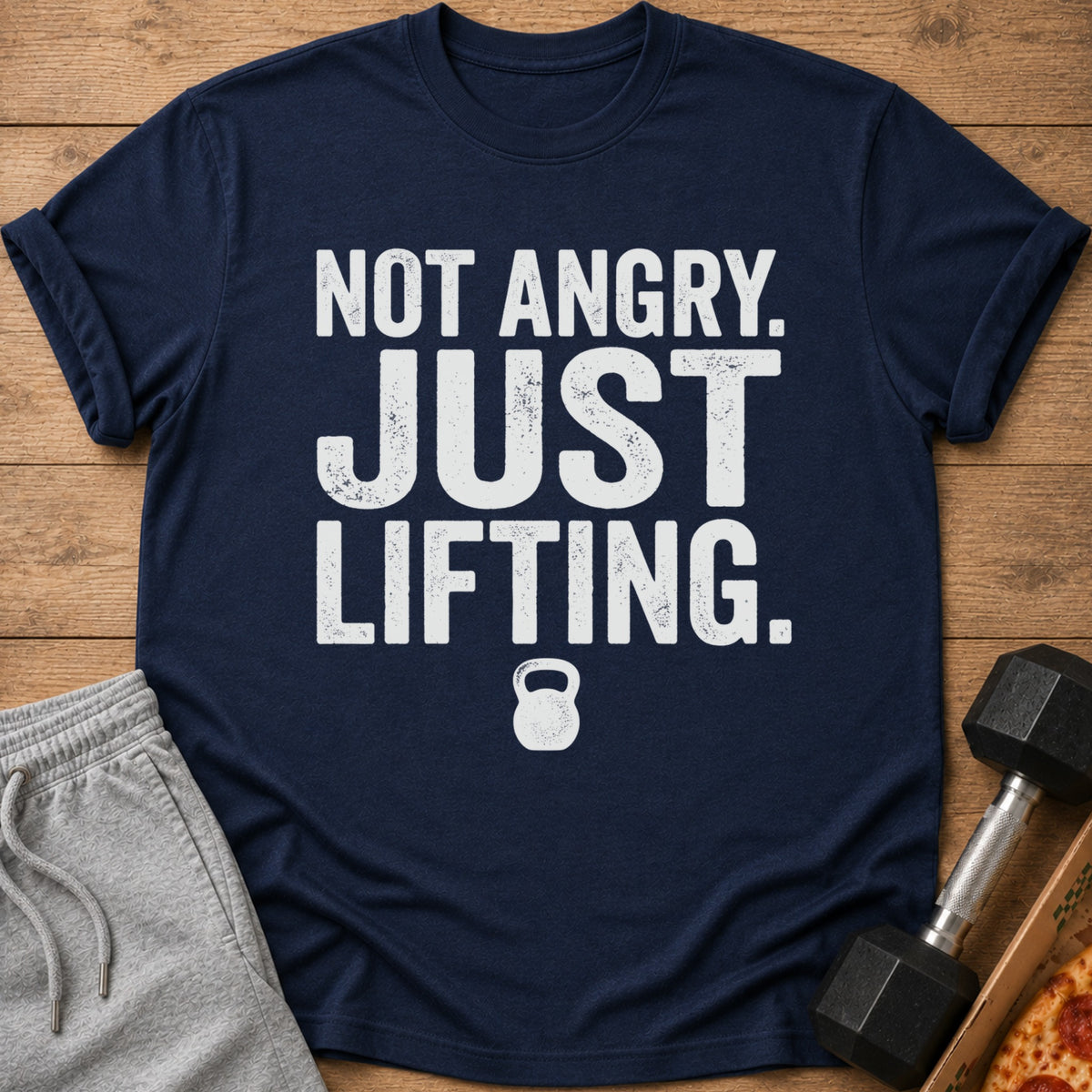 Navy t-shirt with "NOT ANGRY. JUST LIFTING." text and kettlebell graphic.