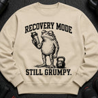 Crewneck sweatshirt with a grumpy frog holding a shaker bottle and a kettlebell. "Recovery Mode Still Grumpy."