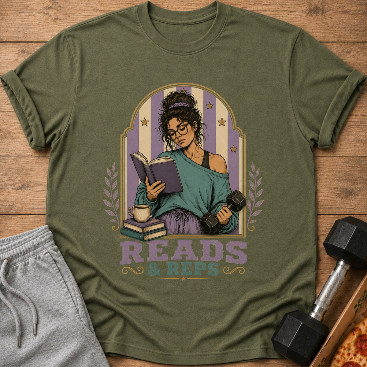 T-shirt graphic of a woman reading a book while holding dumbbells.