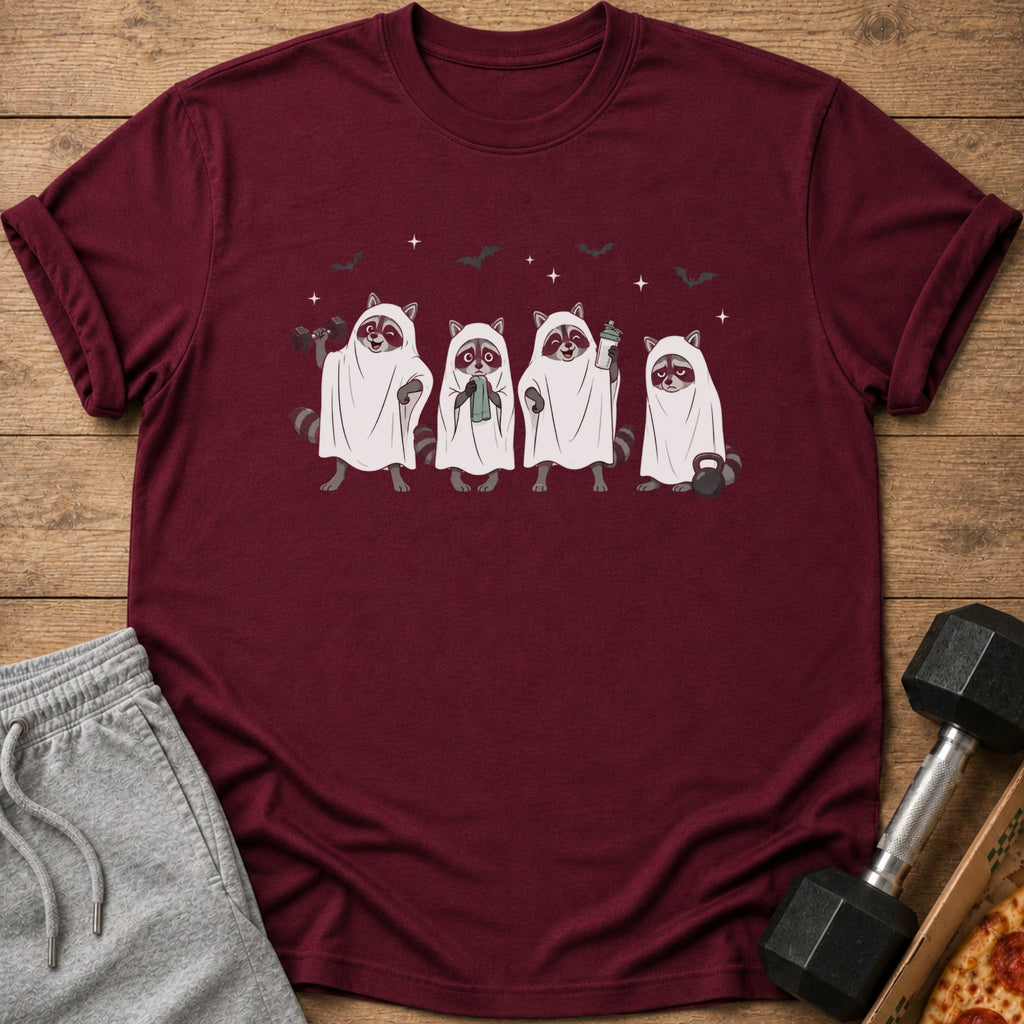 Four raccoons in ghost costumes holding workout items and a dumbbell next to a pizza.