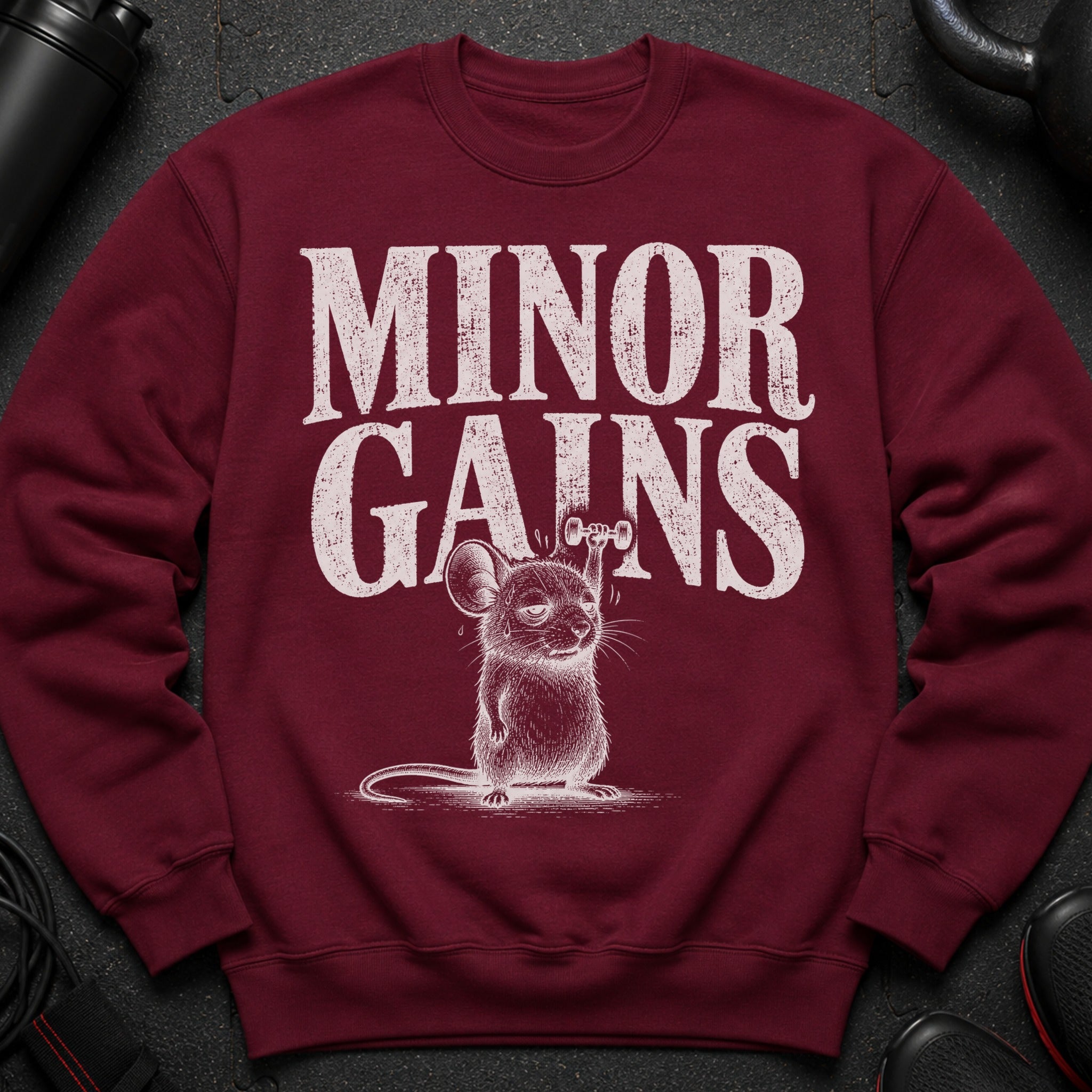 Maroon sweatshirt with "MINOR GAINS" text and weightlifting mouse illustration.
