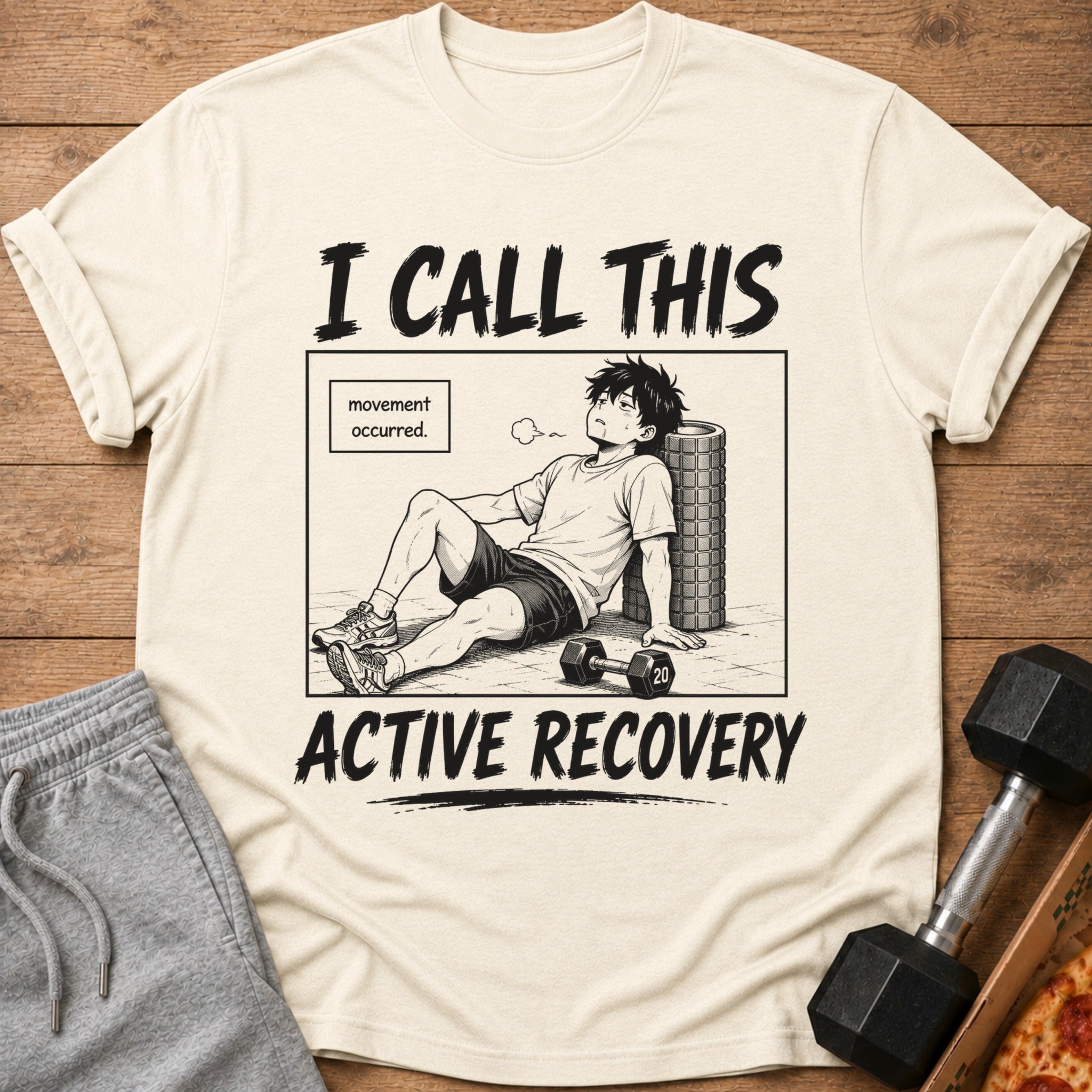 Cream t-shirt with anime art of tired man and text "I CALL THIS ACTIVE RECOVERY".