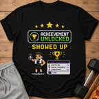 Black t-shirt with "Achievement Unlocked Showed Up" pixel art.