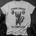 Gray t-shirt with skunk lifting barbell and text "STRONG ENOUGH TO COMPLAIN."