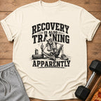 T-shirt with skeleton graphic and text "RECOVERY IS ALSO TRAINING APPARENTLY".