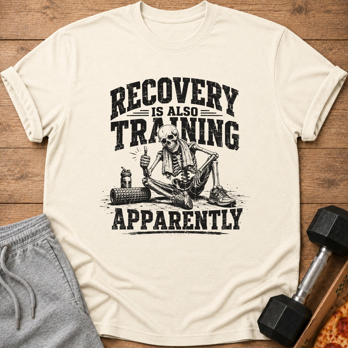 T-shirt with skeleton graphic and text "RECOVERY IS ALSO TRAINING APPARENTLY".