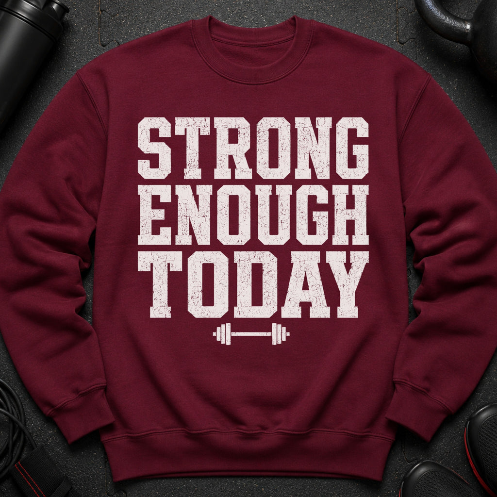 Maroon sweatshirt with distressed white text "STRONG ENOUGH TODAY" and barbell graphic.