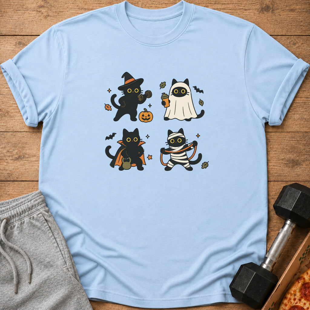 Light blue t-shirt with four black cats in Halloween costumes: witch, ghost, vampire, and mummy.