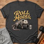 Dark grey t-shirt with "Roll Model" text and an opossum on a foam roller.