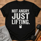 Black t-shirt with "Not Angry. Just Lifting." text and kettlebell graphic.