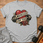 Gray t-shirt with a red broken heart, dumbbells, and a rose with text "Muscles Cry Too".