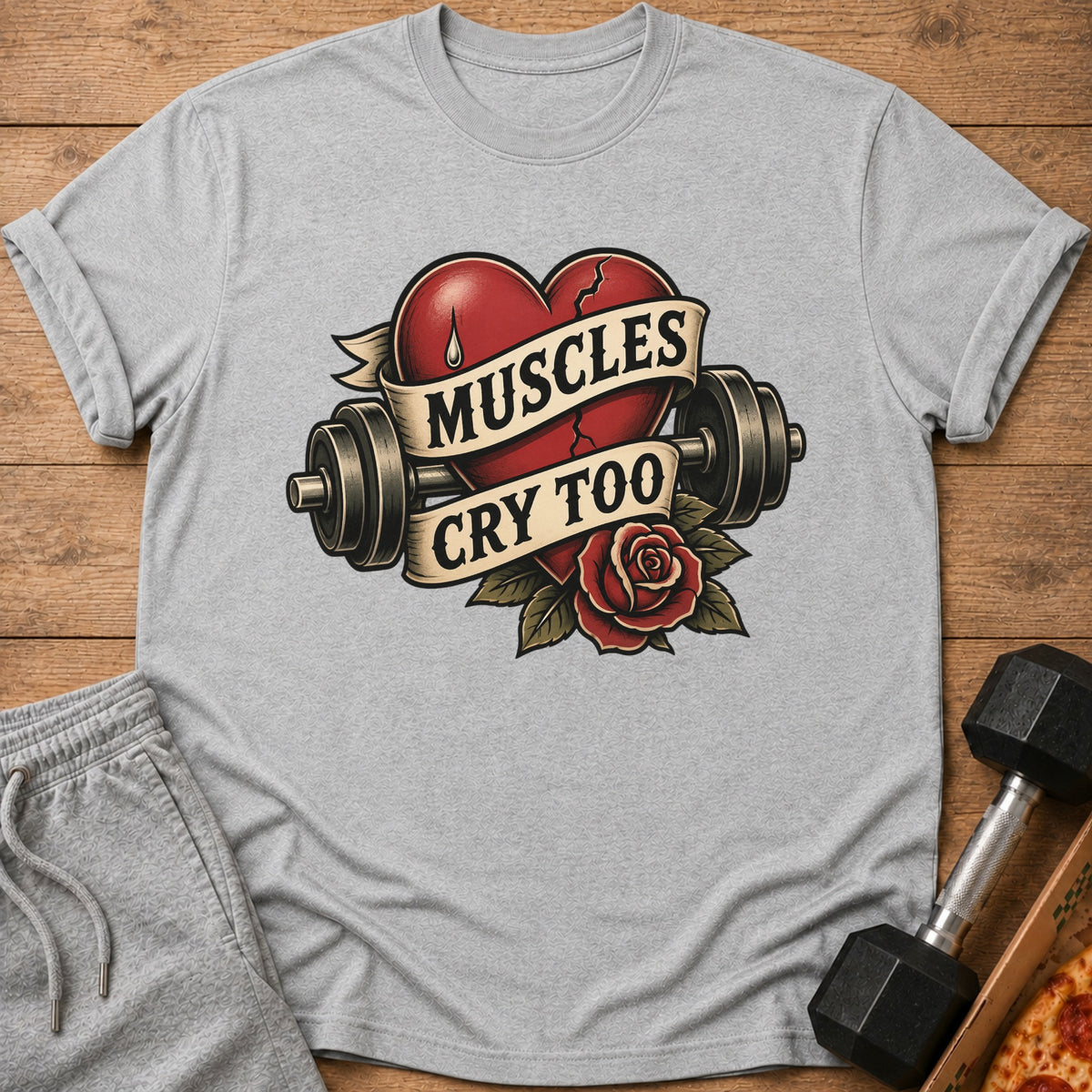 Gray t-shirt with a red broken heart, dumbbells, and a rose with text "Muscles Cry Too".