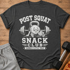 Dark gray t-shirt with distressed graphic "POST SQUAT SNACK CLUB EARNED A LITTLE TREAT".