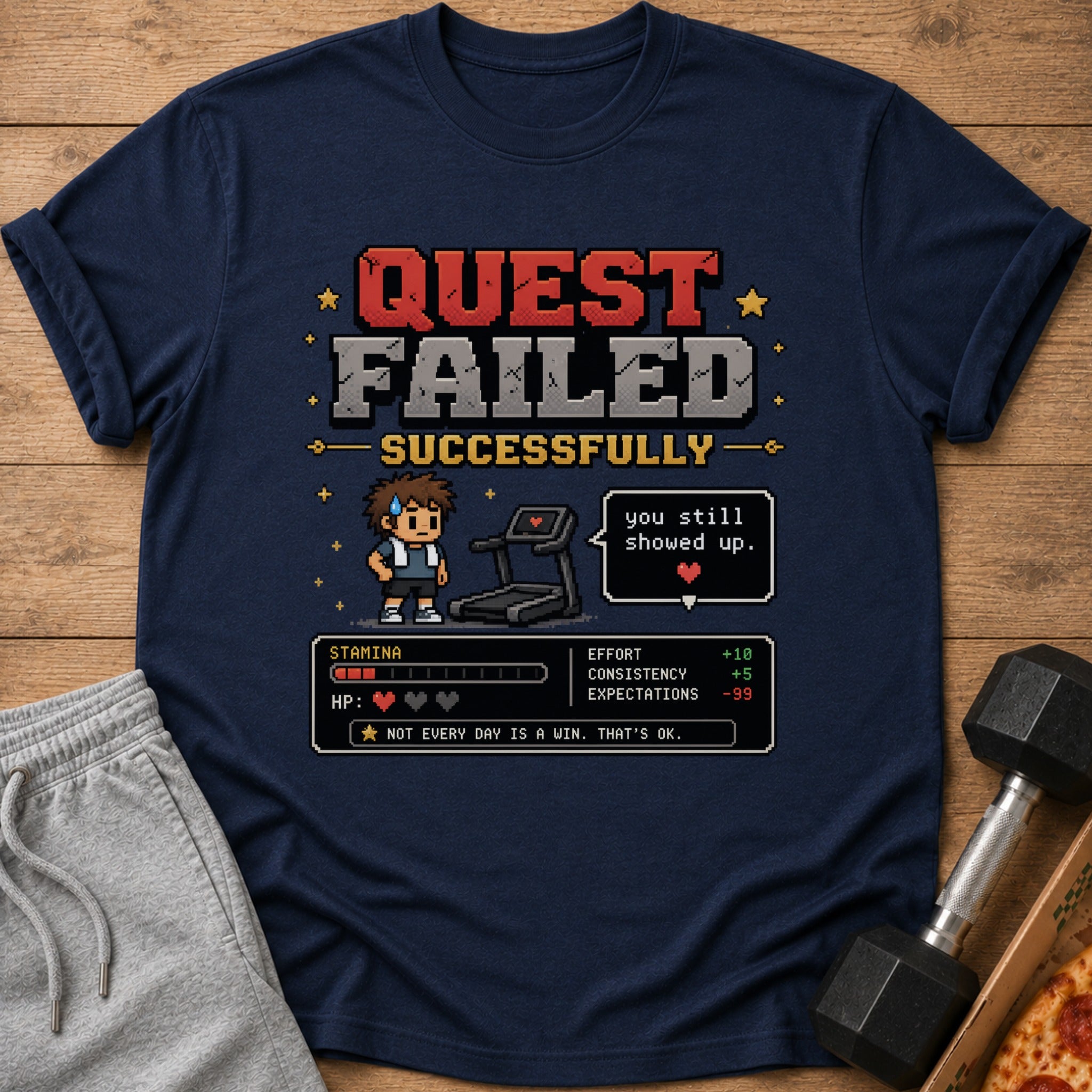T-shirt with "Quest Failed Successfully" pixel art, treadmill, and stats.