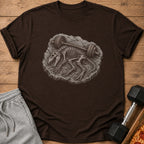 Dinosaur skeleton with barbell on brown t-shirt.