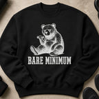 Black sweatshirt with a distressed print of a bear lifting weights with the text "BARE MINIMUM"