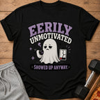 Black t-shirt with ghost lifting 5lb dumbbell, cracked battery, and text "Eerily Unmotivated".