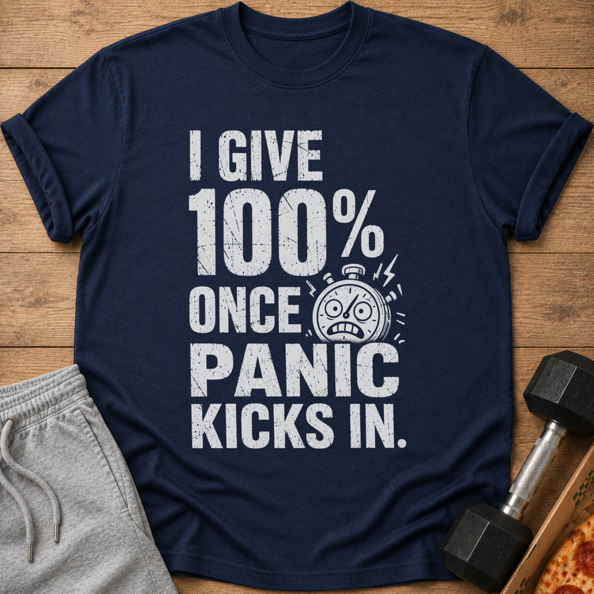 Navy t-shirt with "I GIVE 100% ONCE PANIC KICKS IN." text and a stressed stopwatch.
