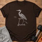 Brown t-shirt with a line drawing of a heron riding a scooter and text "taking it easy".