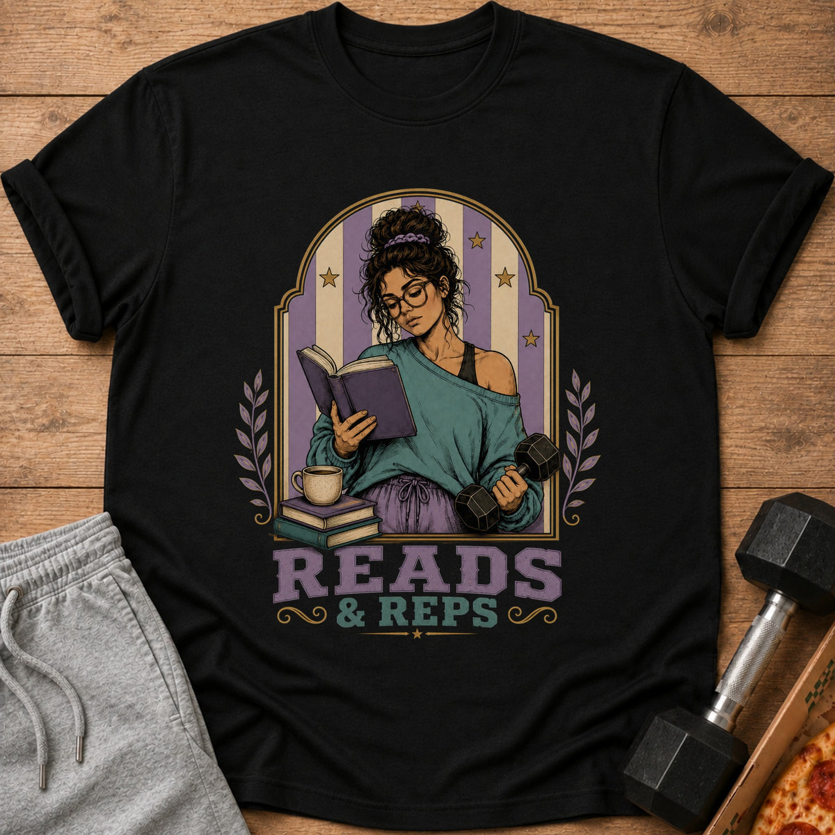 Black t-shirt with "Reads & Reps" text and illustration of a woman reading and holding a dumbbell.