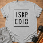 Grey t-shirt with black text "I SKP CDIO" inside a square box.