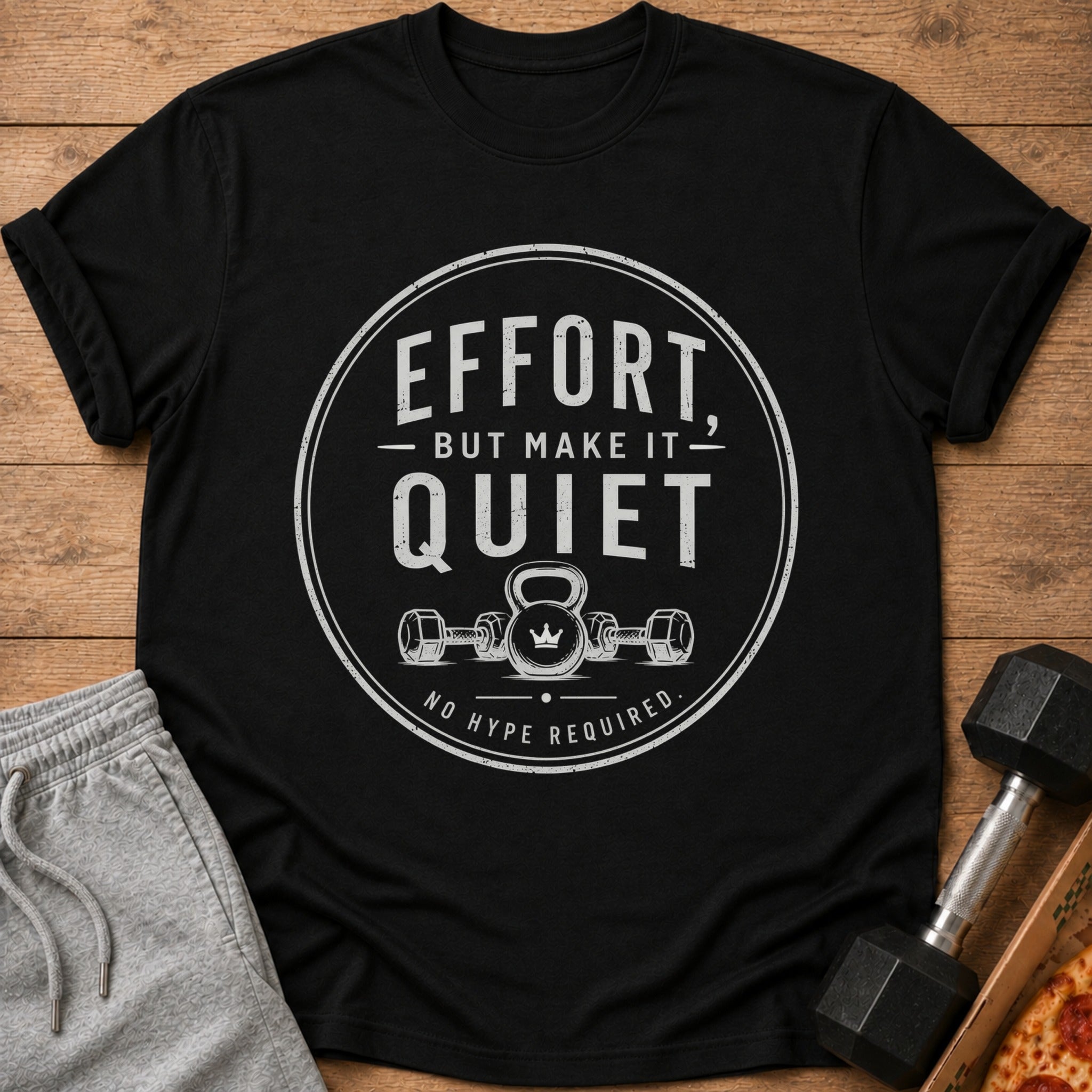 Black t-shirt with "Effort, but make it quiet. No hype required." text and gym graphics.