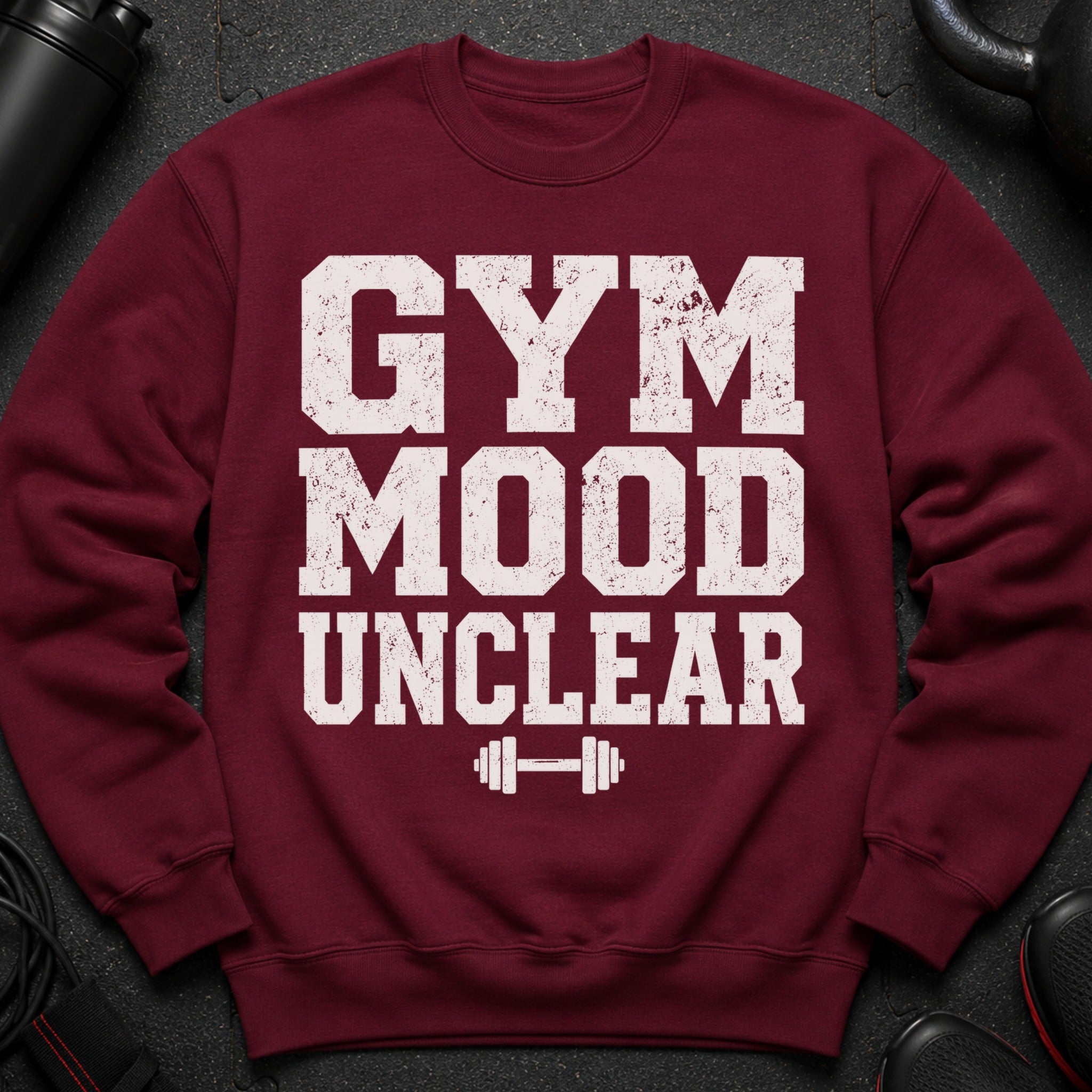 Maroon sweatshirt with white distressed text "GYM MOOD UNCLEAR" and a barbell graphic.