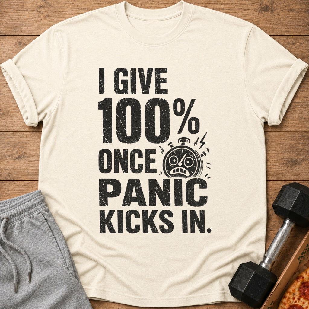 Cream t-shirt with distressed text "I GIVE 100% ONCE PANIC KICKS IN" and a stopwatch graphic.