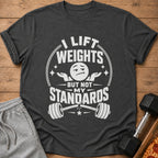 Dark grey t-shirt with "I Lift Weights But Not My Standards" text and barbell graphic.