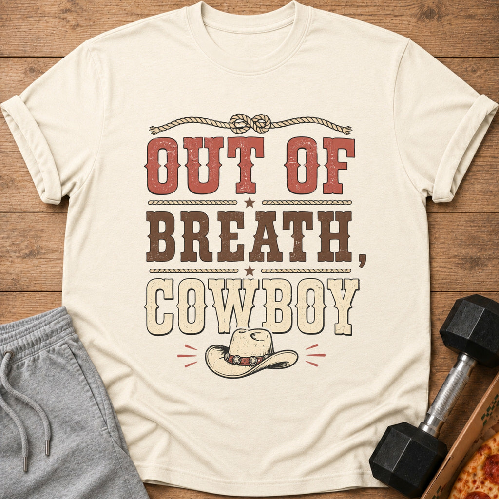 Cream t-shirt with distressed text "OUT OF BREATH, COWBOY" and cowboy hat graphic.