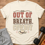 Cream t-shirt with distressed text "OUT OF BREATH, COWBOY" and cowboy hat graphic.