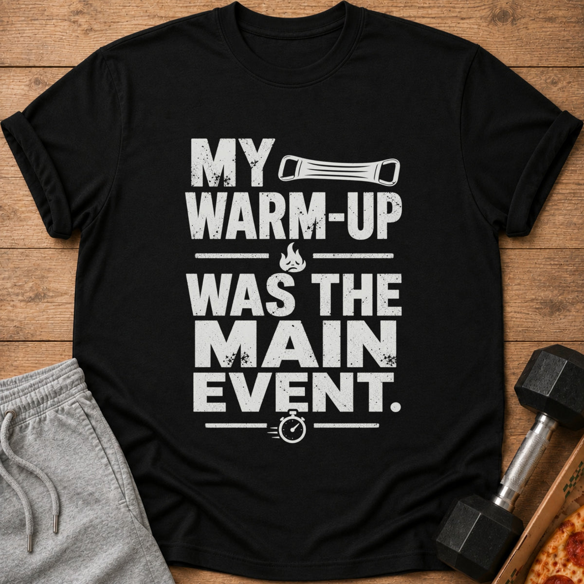 Black t-shirt with text "MY WARM-UP WAS THE MAIN EVENT" and graphics.