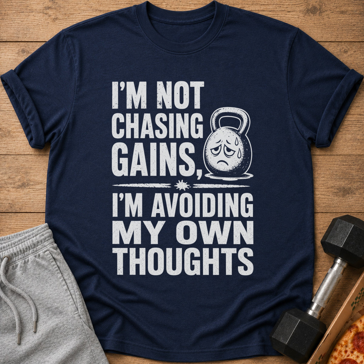 Dark blue t-shirt with white text "I'm Not Chasing Gains, I'm Avoiding My Own Thoughts."