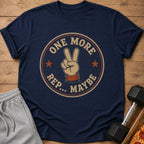 Navy t-shirt with "ONE MORE REP.. MAYBE" graphic and peace sign.