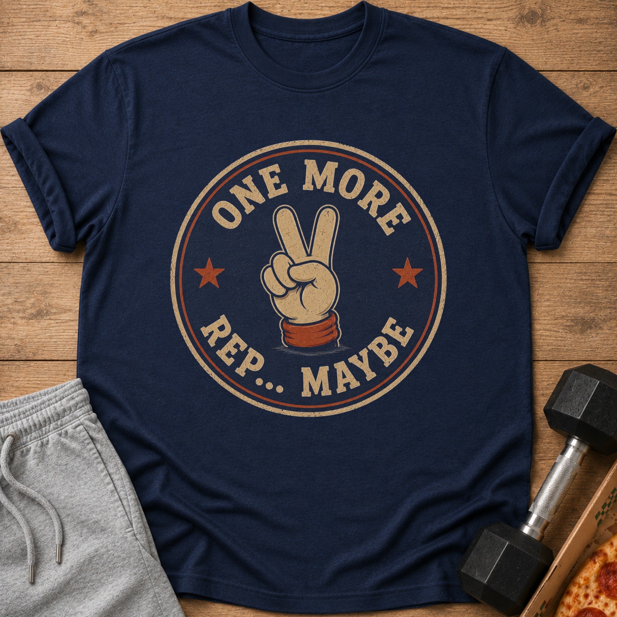 Navy t-shirt with "ONE MORE REP.. MAYBE" graphic and peace sign.
