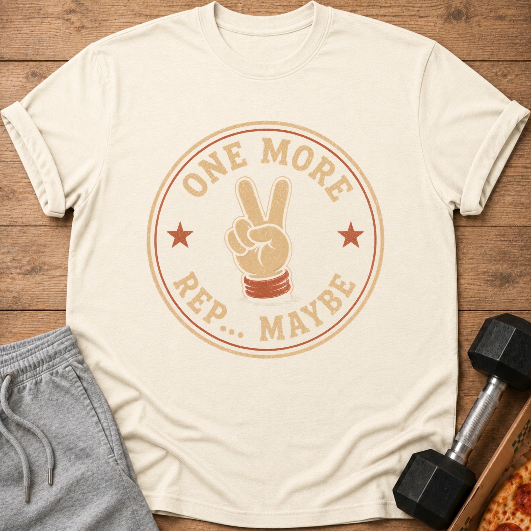 Cream t-shirt with a distressed circular graphic featuring a hand giving a peace sign and text.