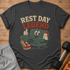 Dark t-shirt with cartoon couch text "REST DAY LEGEND" holding a protein shake.
