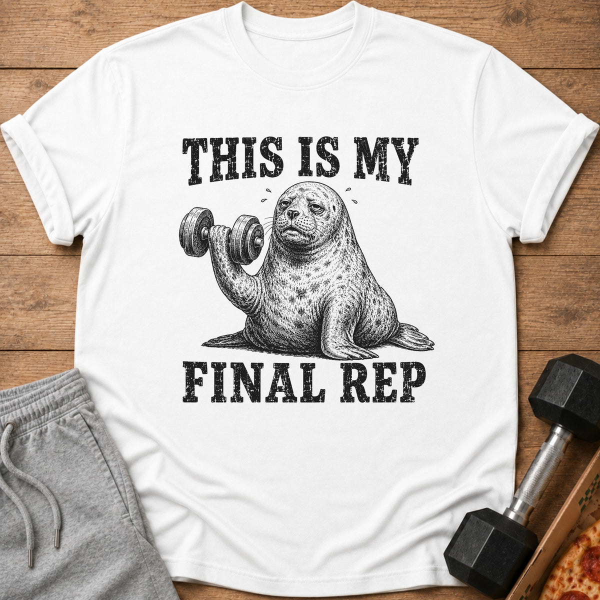 White t-shirt with a seal lifting a dumbbell and text "THIS IS MY FINAL REP".