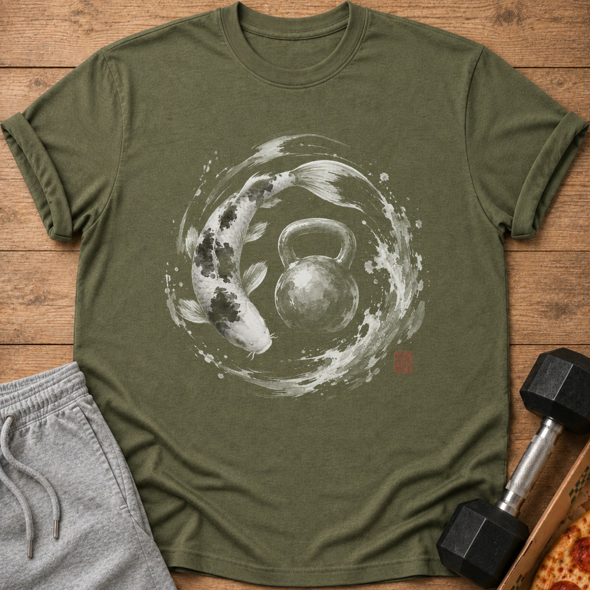 Olive green t-shirt with a black and white koi fish and kettlebell design.