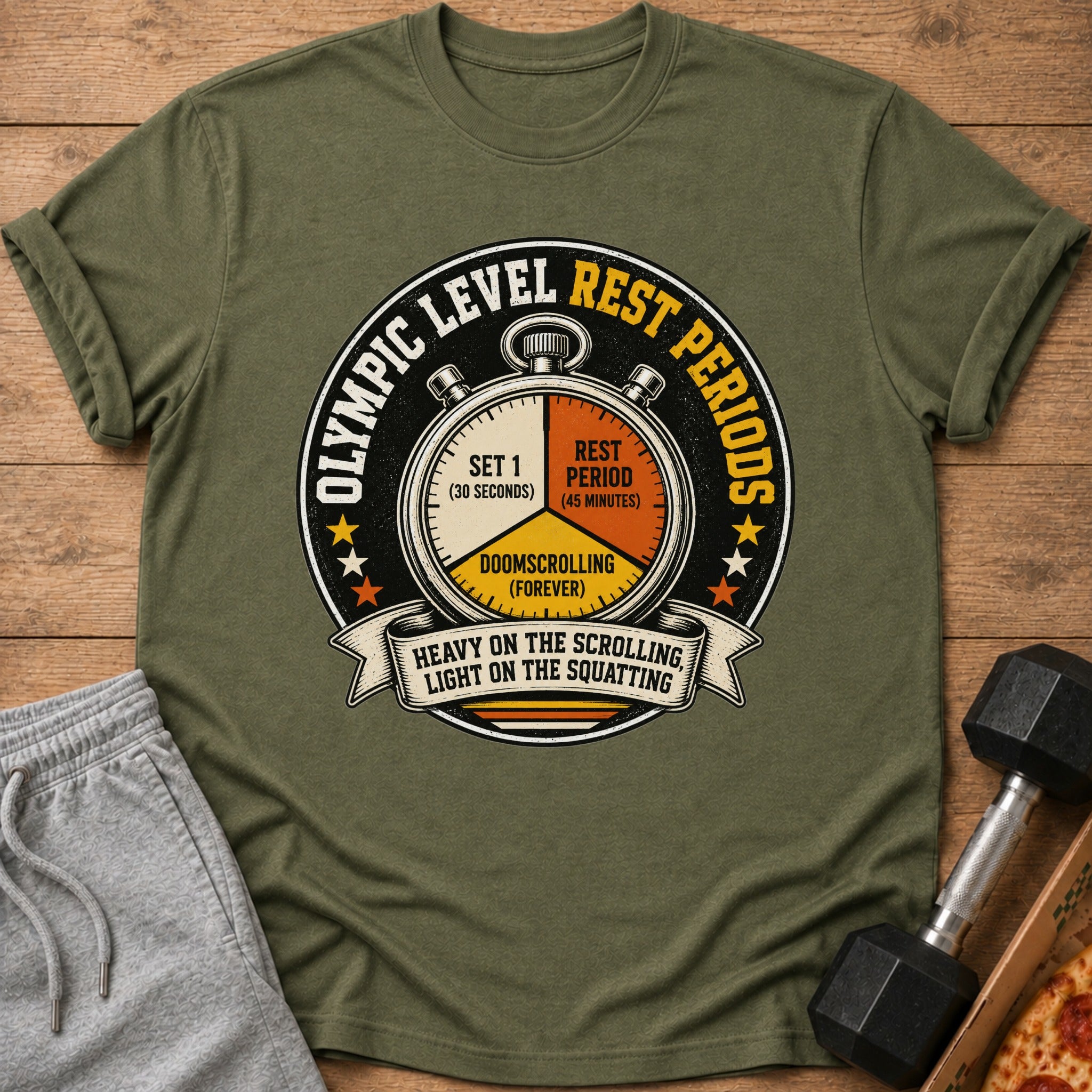 Green t-shirt with graphic of a stopwatch and text "Olympic level rest periods".