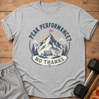 T-shirt with mountain graphic and text "Peak Performance? No Thanks."