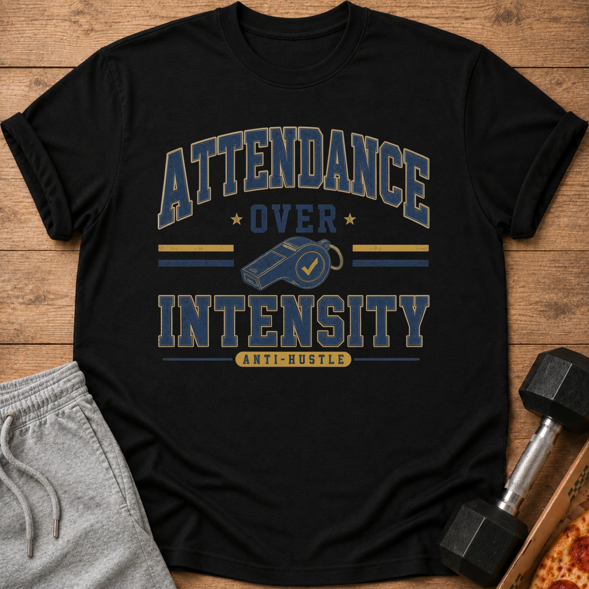 Black t-shirt with "ATTENDANCE OVER INTENSITY" and a whistle graphic.