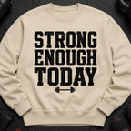 Beige sweatshirt with black distressed "STRONG ENOUGH TODAY" text and barbell graphic.