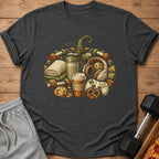 T-shirt with graphic of dumbbells, shaker, headphones, game controller, coffee, and cookies forming a pumpkin.