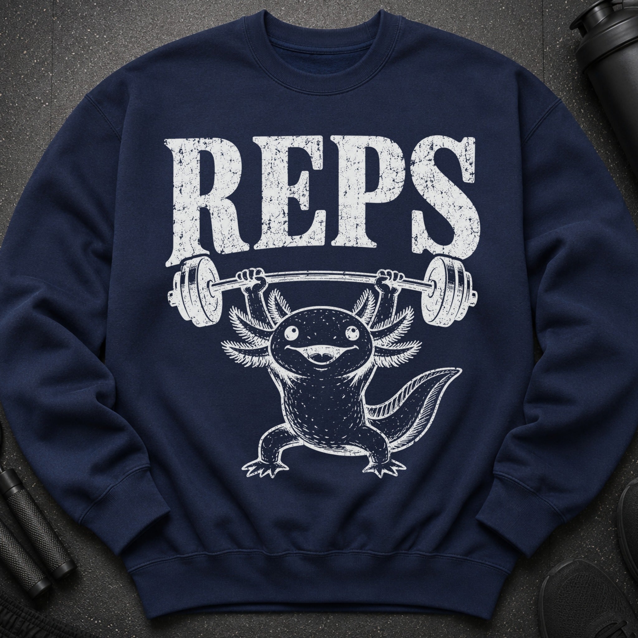 Dark blue sweatshirt with white distressed "REPS" text above an axolotl lifting a barbell.