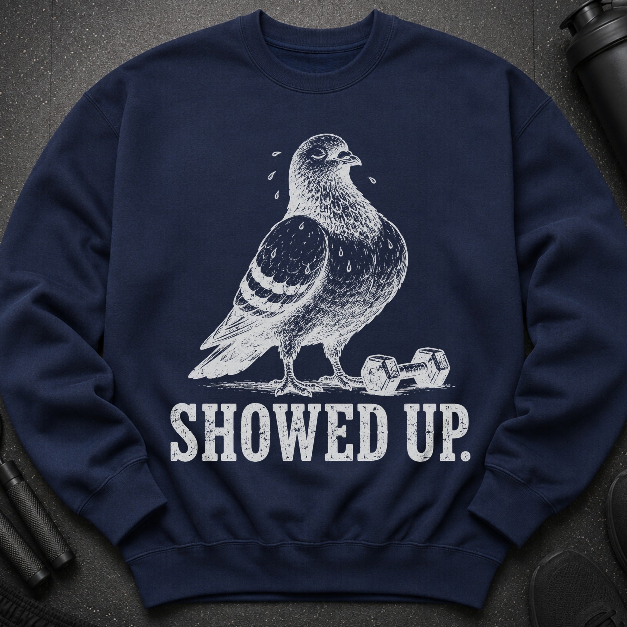Navy sweatshirt with textured print of a pigeon and dumbbells, reads "SHOWED UP".