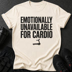 Light cream t-shirt with black text saying "EMOTIONALLY UNAVAILABLE FOR CARDIO" and a treadmill graphic.