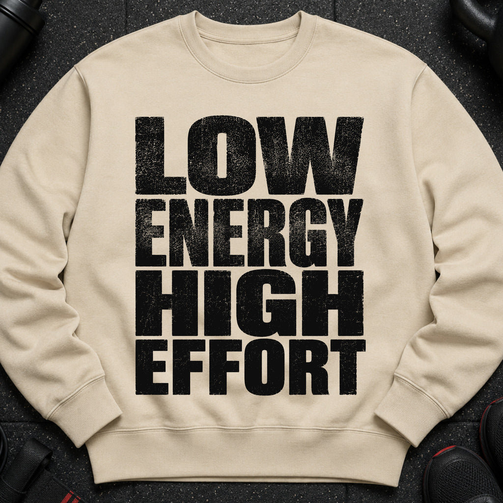 Beige sweatshirt with black distressed text "LOW ENERGY HIGH EFFORT".